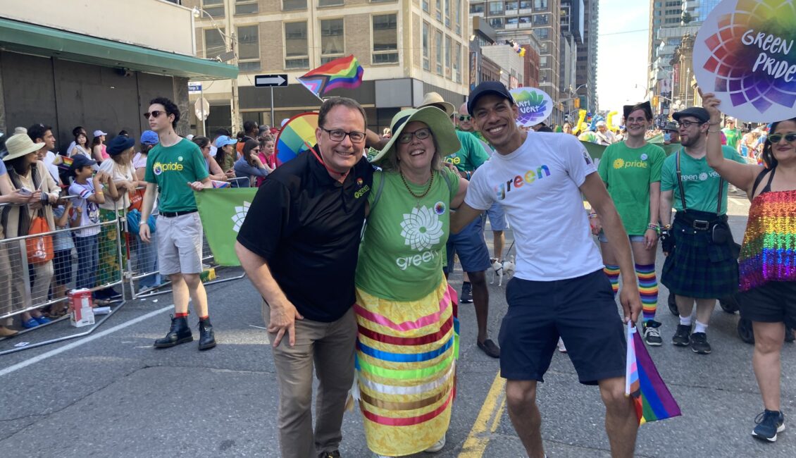 Mike Schreiner, Elizabeth May and Jonathan Pednault walking in the Pride Parade.