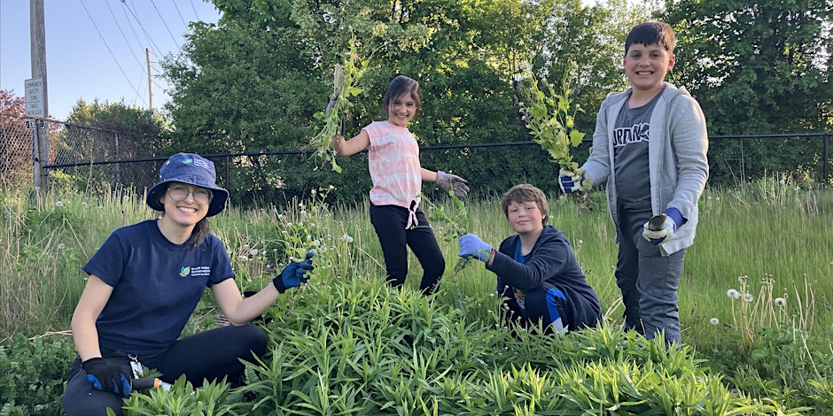 Kids smiling while gardening